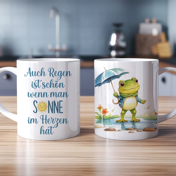 Tasse Niedlicher Frosch mit Regenschirm im Regen Spruch: Auch Regen ist schön wenn man Sonne im Herzen hat - Keramiktasse