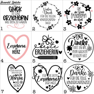 May include: Nine black and white printable designs for a teacher appreciation gift. The designs feature hearts, butterflies, flowers, and pencils with text such as "Gl&uuml;ck ist eine Erzieherin wie dich zu haben", "Beste Erzieherin", and "Danke f&uuml;r die tolle Kindergartenzeit".