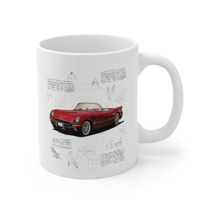 May include: White ceramic mug with a red 1953 Corvette convertible car illustration on a white background with black and gray geometric shapes and handwritten text.