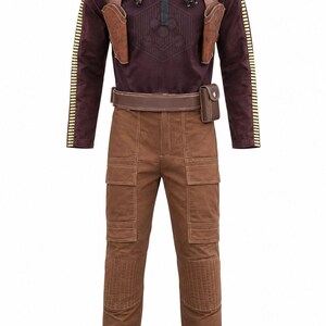 May include: A long-sleeve dark maroon shirt with a black collar, yellow-striped sleeves, and a brown harness featuring two holsters. The outfit includes brown cargo pants with reinforced knee panels, large side pockets, and a brown utility belt.