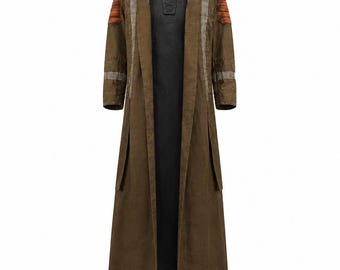 May include: A long, olive-brown coat featuring a structured collar, orange-toned ribbed shoulder panels, and vertical grey accents along the front. The coat is worn over a black, high-neck tunic with a central buttoned placket and long sleeves.