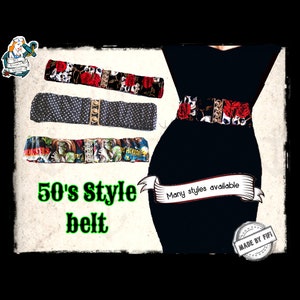 May include: A black dress with a 50's style belt. The belt is made of fabric and has a variety of patterns, including skulls, polka dots, and monsters. The text "50's Style belt" and "Many styles available" is visible in the image. The text "MADE BY FIFI" is also visible in the image.