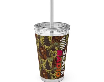 May include: A clear plastic tumbler with a straw featuring a repeating pattern of brown Bigfoot figures in a green forest. The text SLACK RADIO is printed vertically in white, pink, and orange letters on the side of the cup.