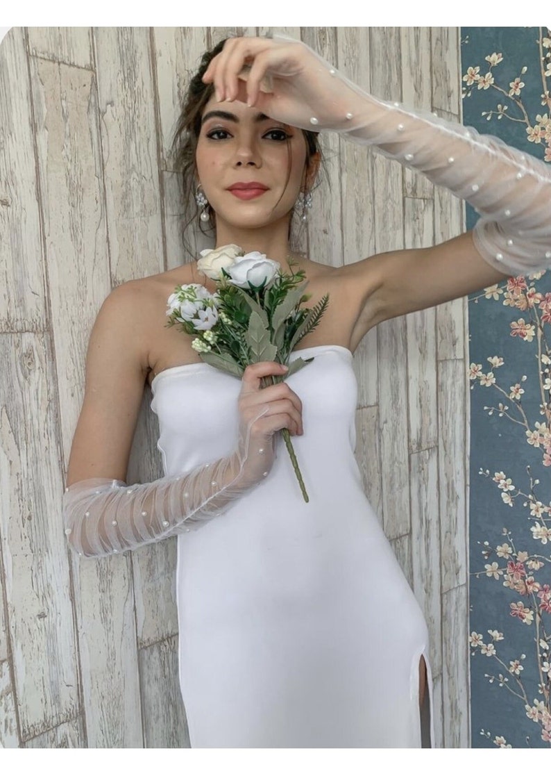 ivory elbow-length bridal sleeves with pearls