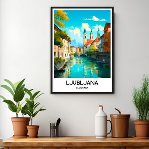 May include: A colorful illustration of Ljubljana, Slovenia, featuring a river flowing through the city with buildings lining the banks. The text "LJUBLJANA" and "SLOVENIA" is printed below the image.