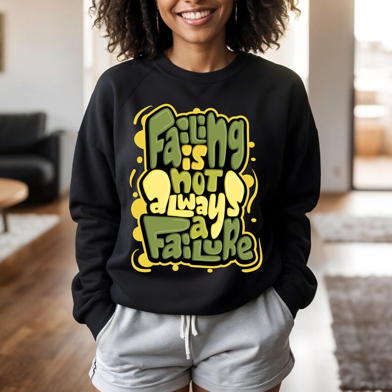 May include: Black sweatshirt with a green and yellow graphic print that says "Failing is not always a failure".