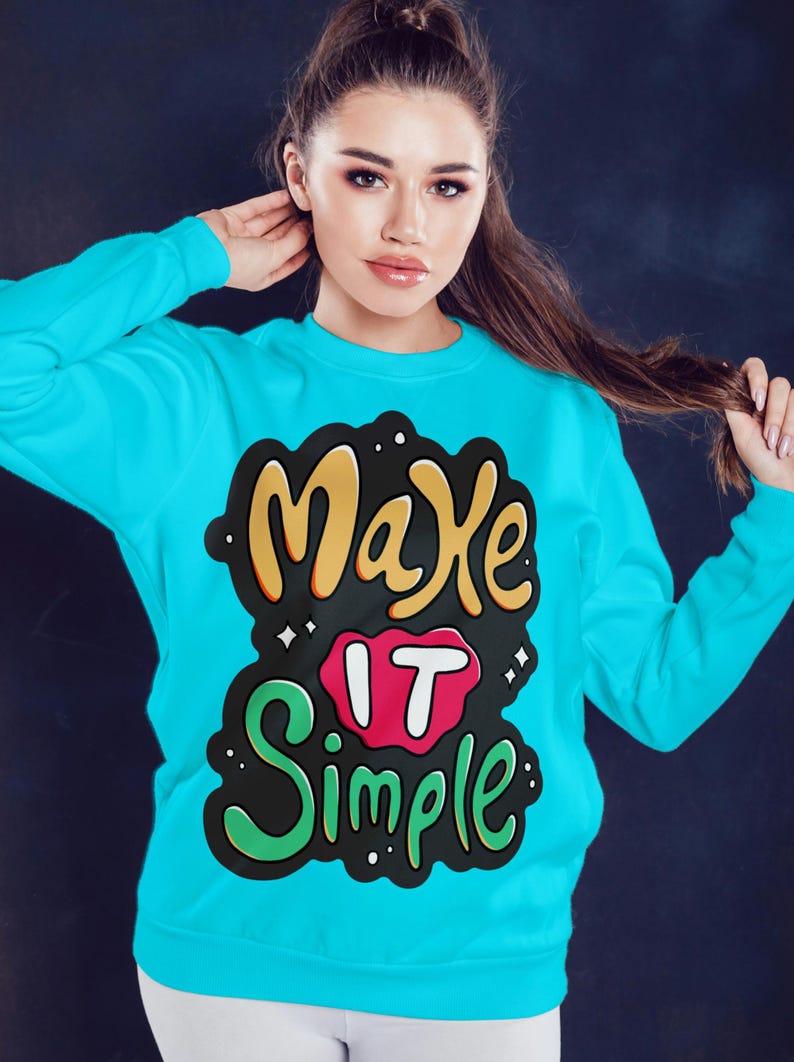 May include: A turquoise blue sweatshirt with a black, green, yellow, and red graphic print that says "Make it Simple".