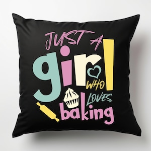 May include: Black square cushion featuring the phrase "Just a girl who loves baking" in pink, yellow, and blue. The design includes a cupcake, rolling pin, and heart.