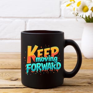 May include: Black ceramic coffee mug with a colorful graphic that says "Keep moving forward".