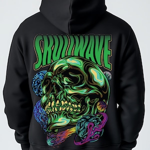 May include: A black hoodie featuring a large graphic on the back. The design displays a green, metallic-looking skull surrounded by colorful planets and a comet. Above the skull, the text SKULLWAVE is printed in bold, green, stylized letters.