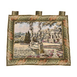 May include: A tapestry featuring a scenic garden landscape with a stone pathway, bench, and a classical gazebo. The tapestry has a decorative border with floral and geometric patterns. The color palette includes greens, beige, and touches of pink and blue.