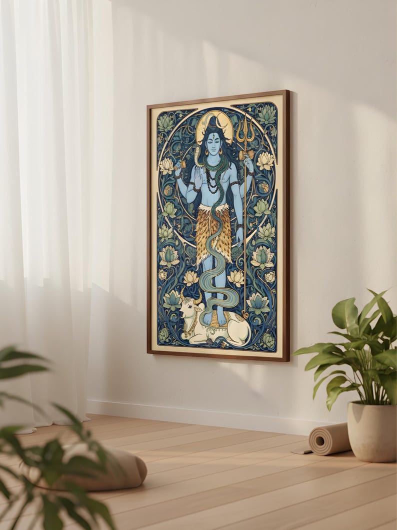 Peut inclure: Une impression d'art encadr&eacute;e repr&eacute;sentant une divinit&eacute; &agrave; la peau bleue tenant un trident et d'autres symboles. L'&oelig;uvre pr&eacute;sente un fond floral d&eacute;taill&eacute; en bleu et vert, avec une vache blanche en bas. Le cadre est de couleur marron chaud.
