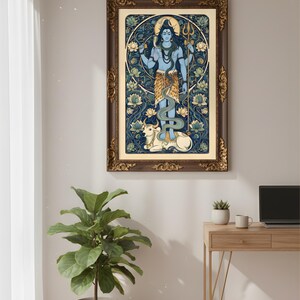 Peut inclure: Une impression d'art encadr&eacute;e repr&eacute;sentant une divinit&eacute; bleue avec plusieurs bras, tenant un trident et d'autres symboles. L'&oelig;uvre est plac&eacute;e sur un fond de motifs floraux bleus et dor&eacute;s, avec un taureau blanc en bas. Le cadre est marron fonc&eacute; avec des accents dor&eacute;s.