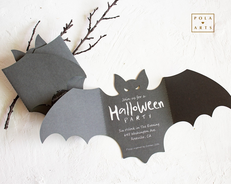 May include: A black bat-shaped invitation with white text that reads "Join us for a Halloween Party" and includes the date, time, and address. The invitation is on a white background with a branch.