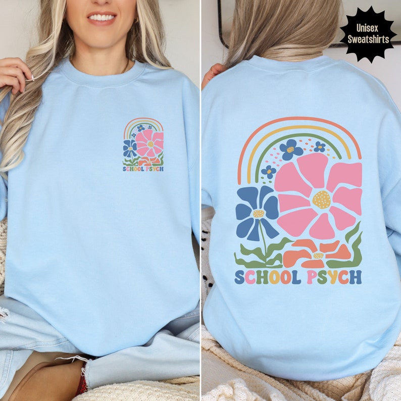 May include: Light blue sweatshirt with a rainbow and flower design. The text "SCHOOL PSYCH" is printed on the front and back of the sweatshirt.