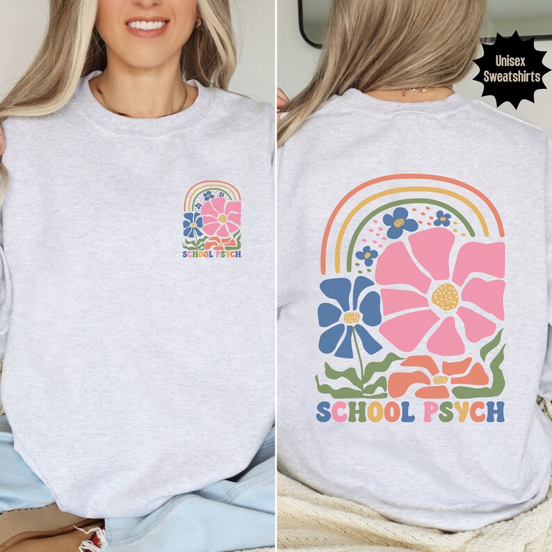 May include: A grey unisex sweatshirt with a rainbow and flower design. The text "SCHOOL PSYCH" is printed on the front and back of the sweatshirt.