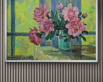 May include: A framed oil painting depicts a bouquet of pink peonies in a turquoise vase. The flowers are set against a backdrop of a window with green and blue hues. The painting is in a silver frame, with a dark striped wall in the background.