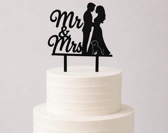 Cake topper for newlyweds with dog and writing