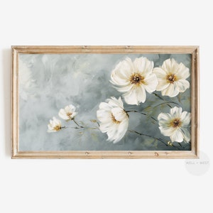 May include: A framed painting of white flowers with yellow centers on a blue background.