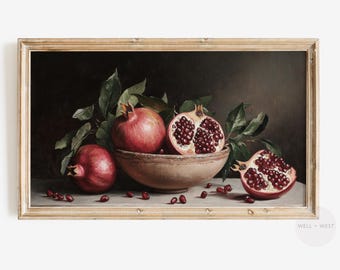 May include: A still life painting depicting pomegranates in a bowl. The pomegranates are red and have been cut open to reveal the seeds inside. The bowl is brown and has a rustic appearance. The background is dark and the painting has a vintage feel.