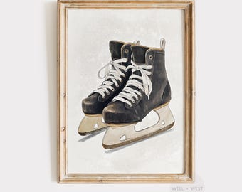 May include: A framed print featuring a pair of black ice skates with white laces. The skates are set against a neutral background, creating a vintage aesthetic. The blades are silver, and the artwork is signed "WELL + WEST ART COLLECTION".
