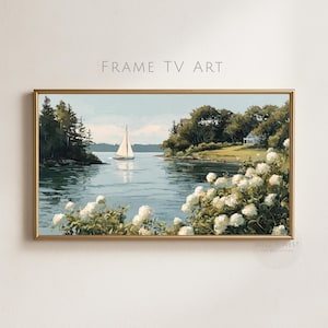May include: A rectangular landscape painting in a gold frame titled FRAME TV ART. The scene depicts a sailboat on calm water surrounded by green trees and a white house on the shore. White hydrangea flowers bloom in the foreground.