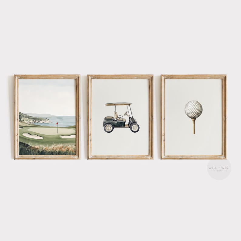 May include: Set of three framed watercolor prints with a golf theme. The prints feature a golf course landscape, a golf cart, and a golf ball on a tee. The frames are a light brown color.