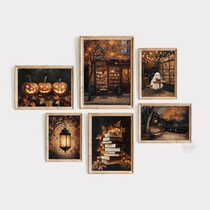 May include: Six framed art prints with a Halloween and autumn theme. The prints show pumpkins, a bookstore, a ghost at a cafe, a lantern, a stack of books, and a park scene, all in warm, autumnal colours.