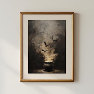 May include: A framed print depicting a cauldron with billowing smoke and bats against a dark background. The artwork has a gothic aesthetic, with a gold frame. The overall theme is Halloween or a similar spooky concept.