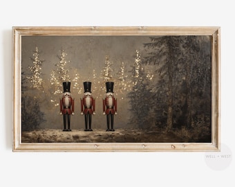 May include: Three red and black nutcracker figurines stand in a row in front of a snowy forest scene. The forest is lit with twinkling lights and the nutcrackers are wearing black hats and have white faces.