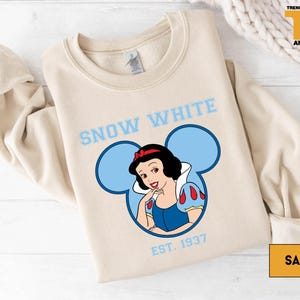 a snow white shirt with a snow woman on it