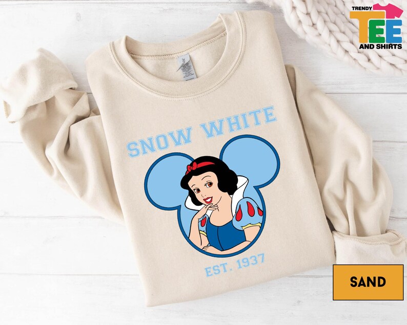 a snow white shirt with a snow woman on it