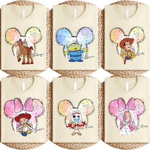 a set of four disney mouse shirts