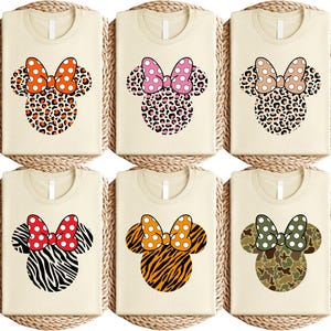 a set of four mickey mouse coasters