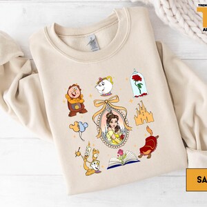 a sweatshirt with a picture of beauty and the beast on it