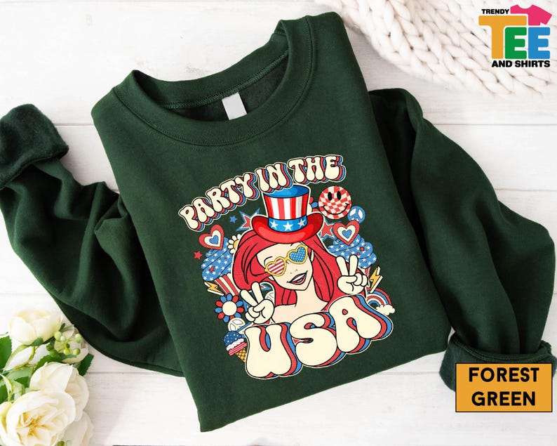 a green shirt with a picture of a girl in a top hat