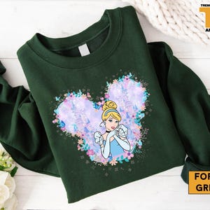 a green shirt with a picture of a princess on it