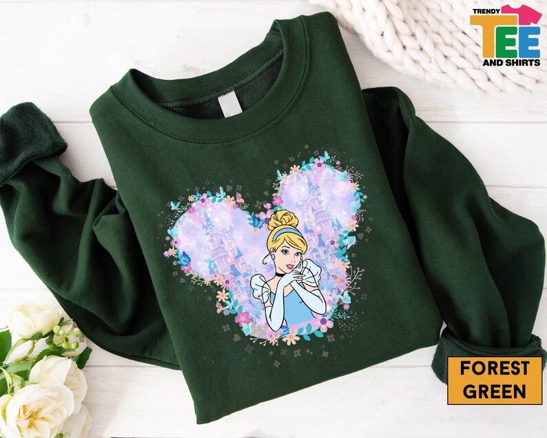 a green shirt with a picture of a princess on it