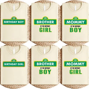 May include: Six cream-colored t-shirts with various text designs. The shirts feature green and yellow text that reads "Birthday Boy," "Brother of the Birthday Girl," "Mommy of the Birthday Boy," "Birthday Girl," "Brother of the Birthday Boy," and "Mommy of the Birthday Girl."