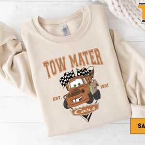 a t - shirt with a tow truck on it