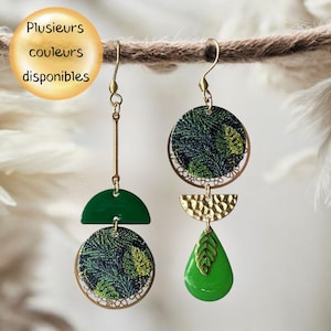 May include: Asymmetrical dangle earrings featuring gold-tone hooks. The left earring has a long bar, a green semi-circle, and a circular pendant with a dark green leaf pattern. The right earring has a circular leaf pendant, a hammered gold semi-circle, and a bright green teardrop charm.