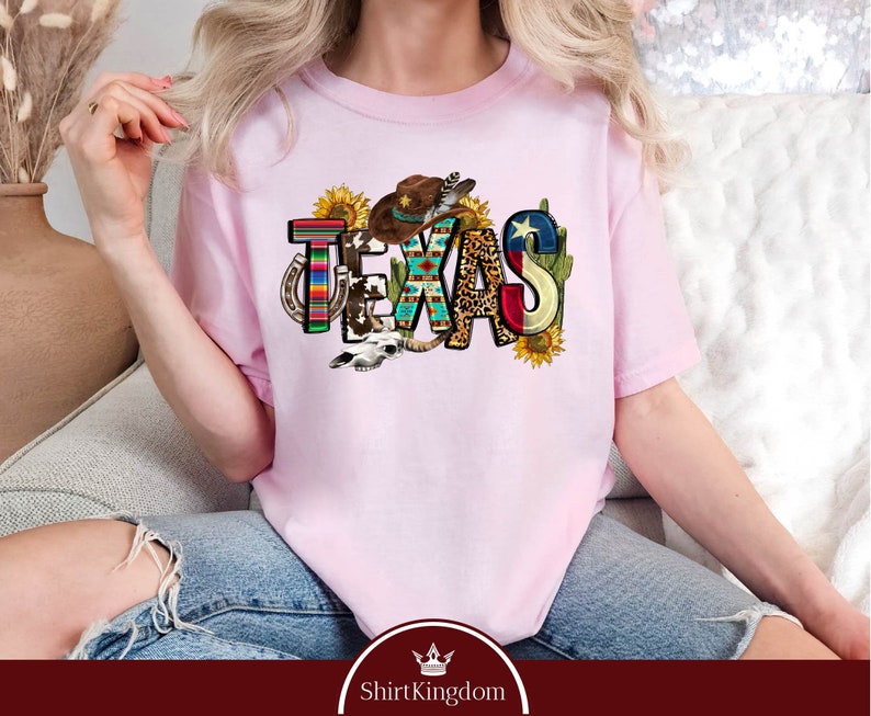 a woman sitting on a couch wearing a pink tshirt