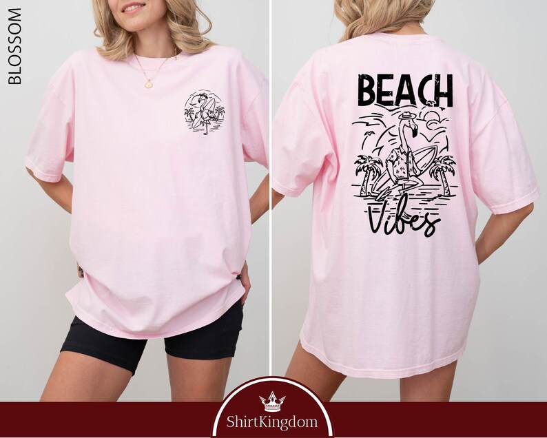 a woman wearing a pink beach vibe shirt
