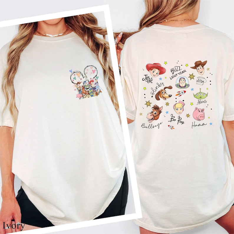 A woman wearing a white t-shirt with various cartoon characters and designs printed on it.