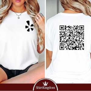 May include: White t-shirt with a black five-pointed star logo on the front and a black QR code on the back.