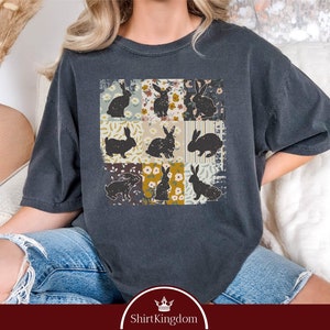 a woman wearing a t - shirt with cats on it