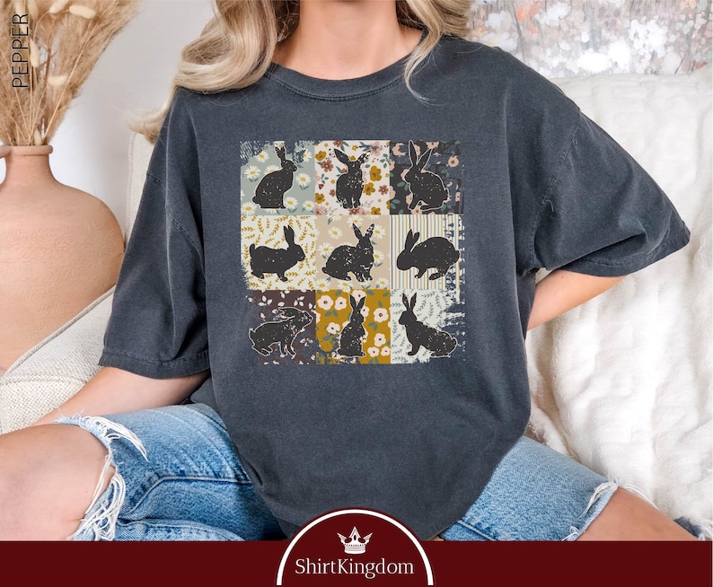 a woman wearing a t - shirt with cats on it