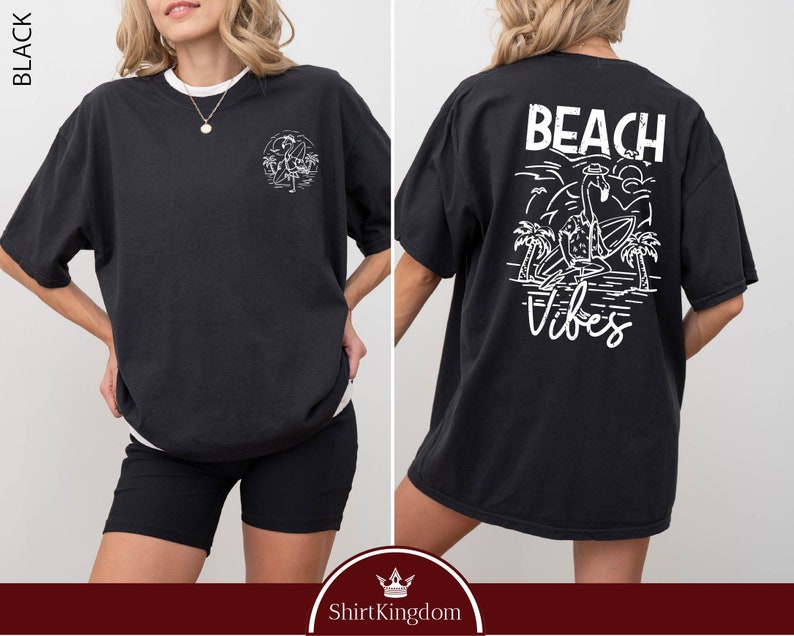 a woman wearing a black beach vibe shirt