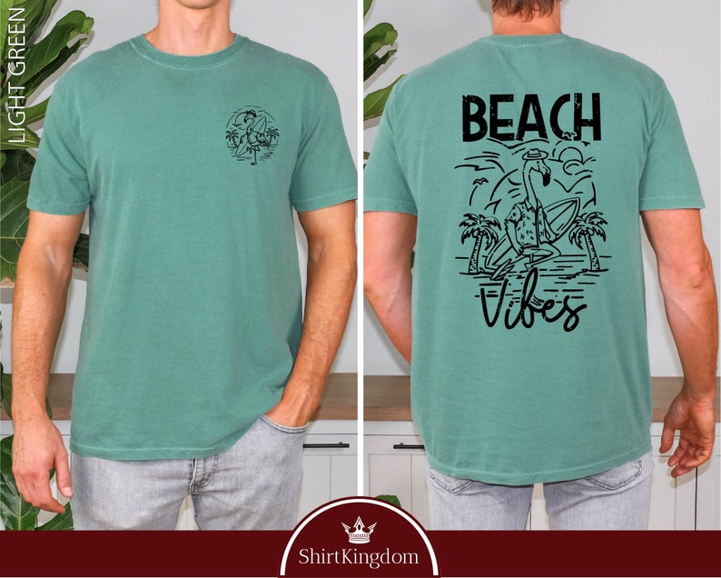 a man wearing a t - shirt that says beach vibes