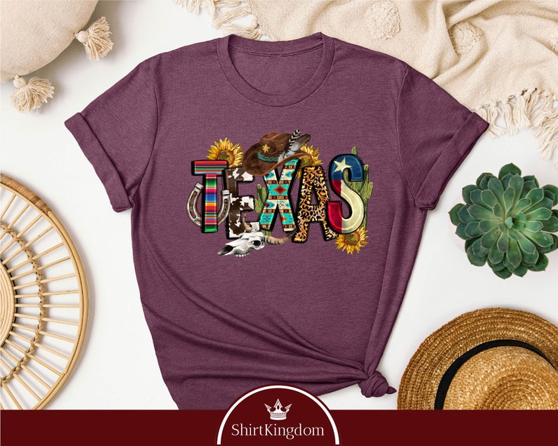 a purple tshirt with the word cats on it
